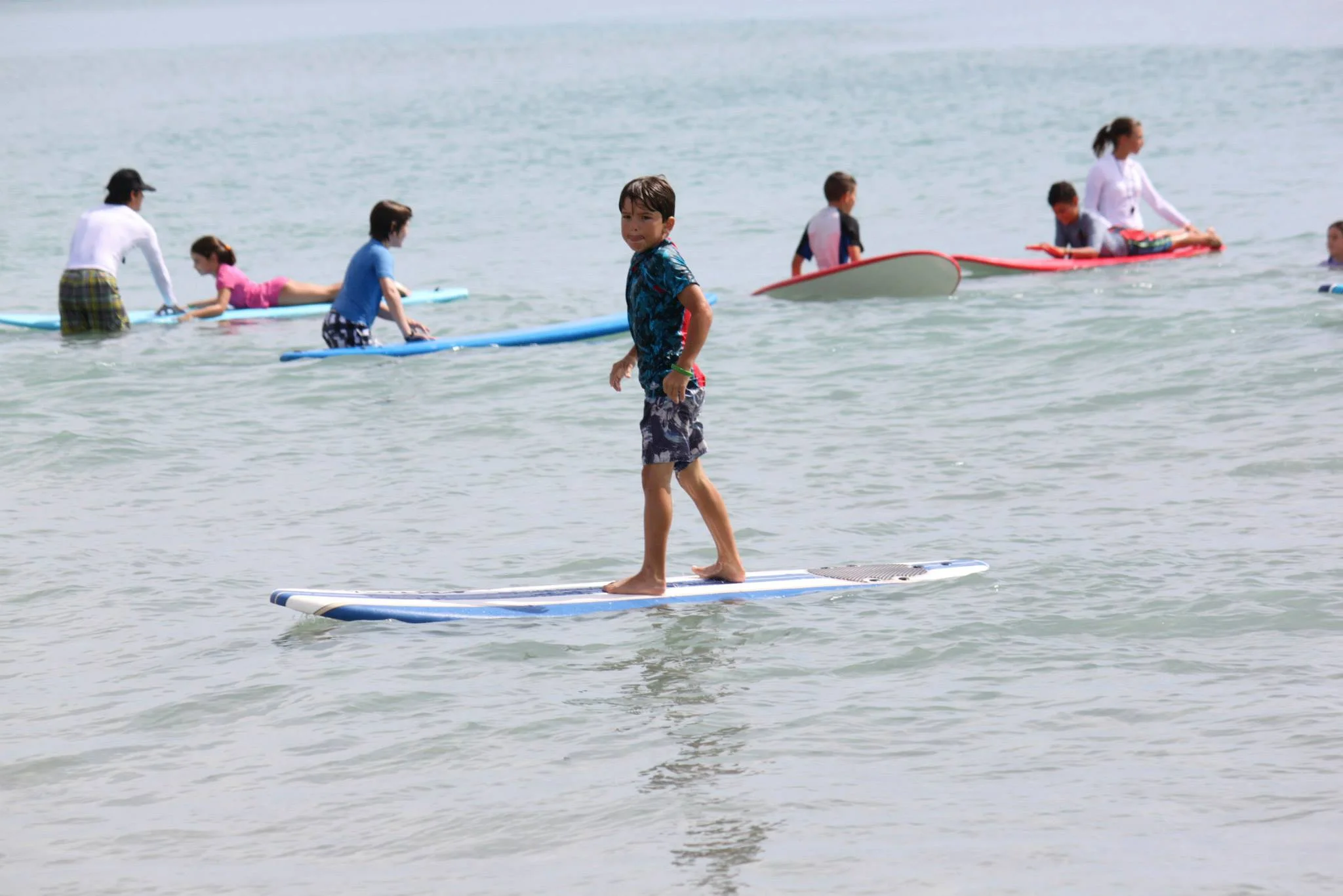 Young surfer catching a wave at Jupiter Inlet