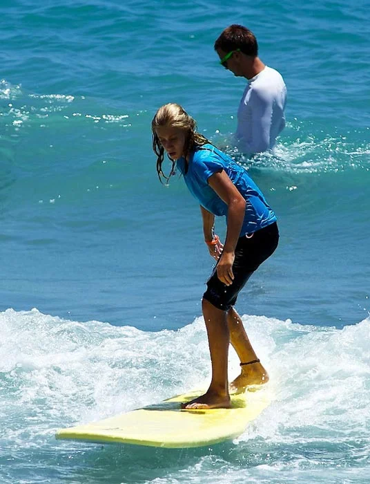 Kids paddling out at Jupiter sandbar