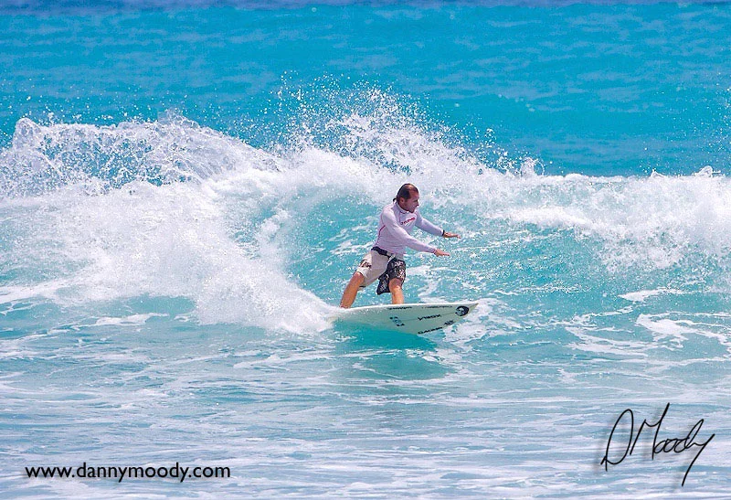 William Kimball, founder of Blue Water School of Surfing, surfing at Jupiter Inlet